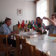 The Conference staff prepares the national flags